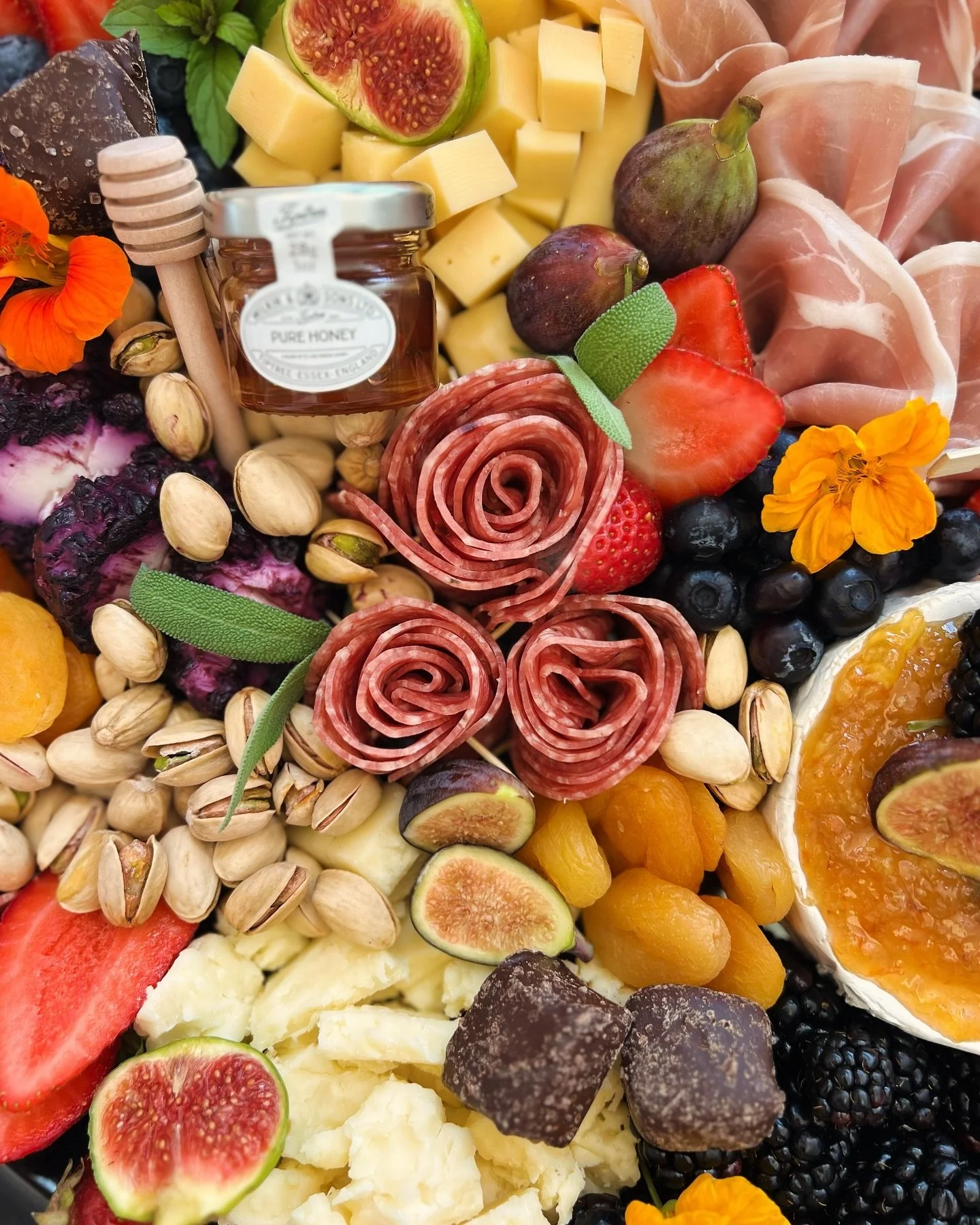 A colorful cheese and charcuterie platter by Posh Persian Boards at The Spa at Yellow Creek in Akron, Ohio.