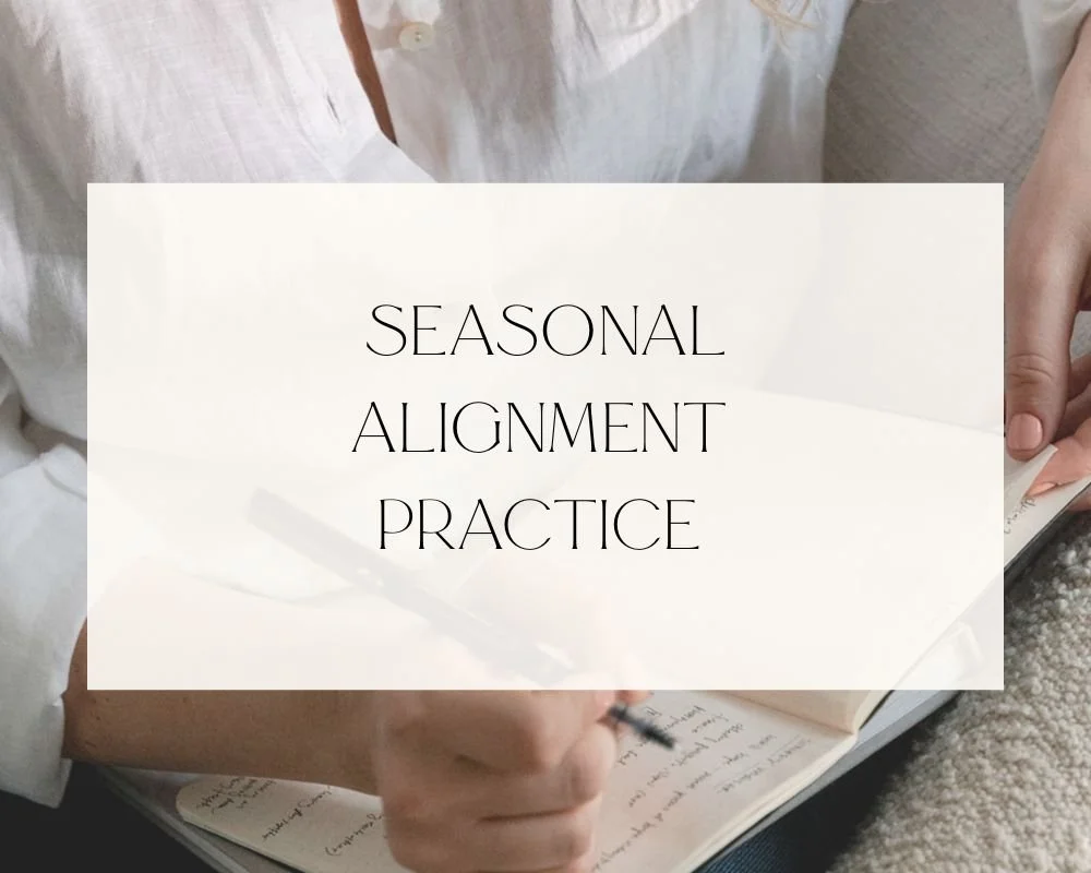 A person writing in a notebook with a white overlay text that reads 'Seasonal Alignment Practice'.