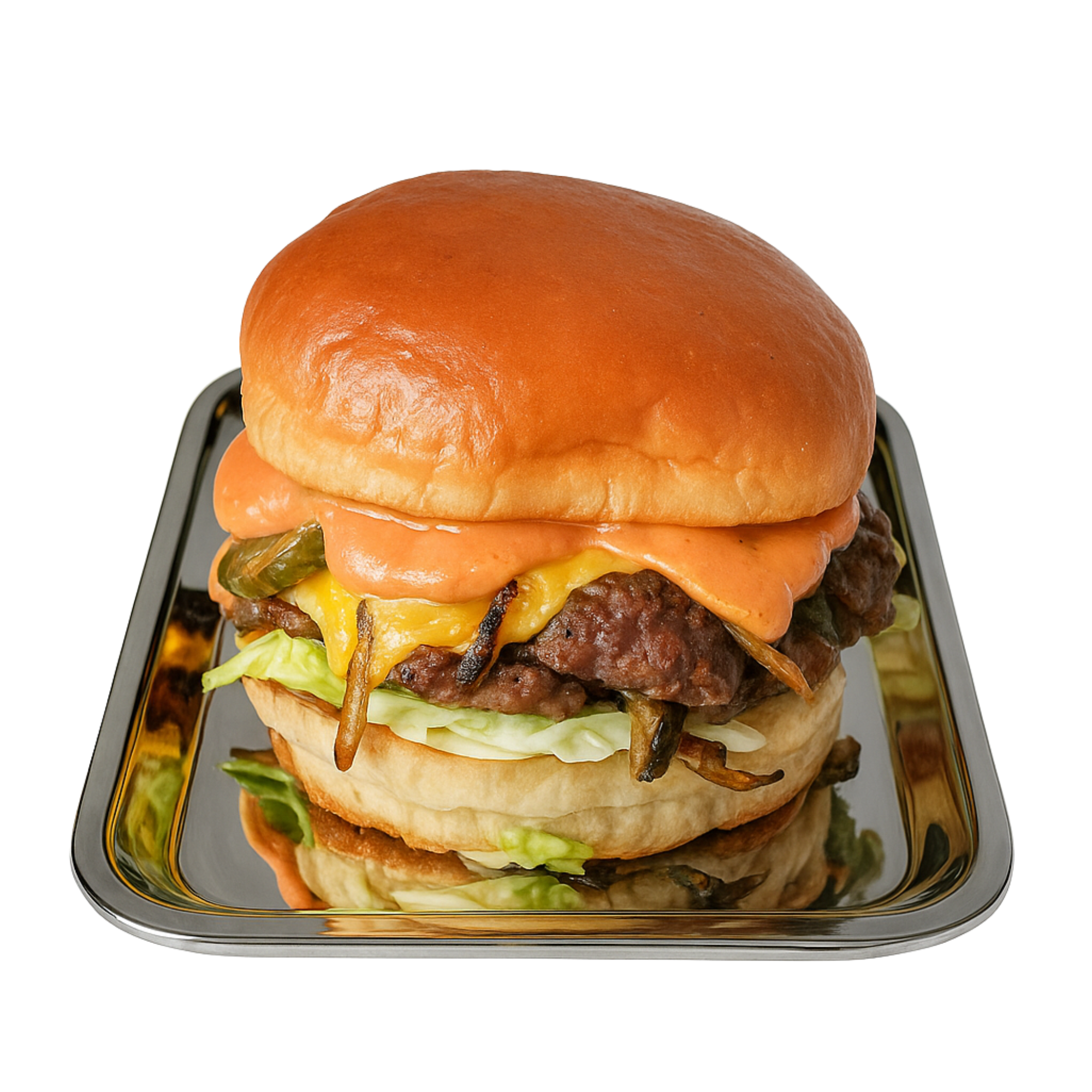 Cheeseburger with lettuce, grilled onions, and sauce on a bun, served on a metal tray.