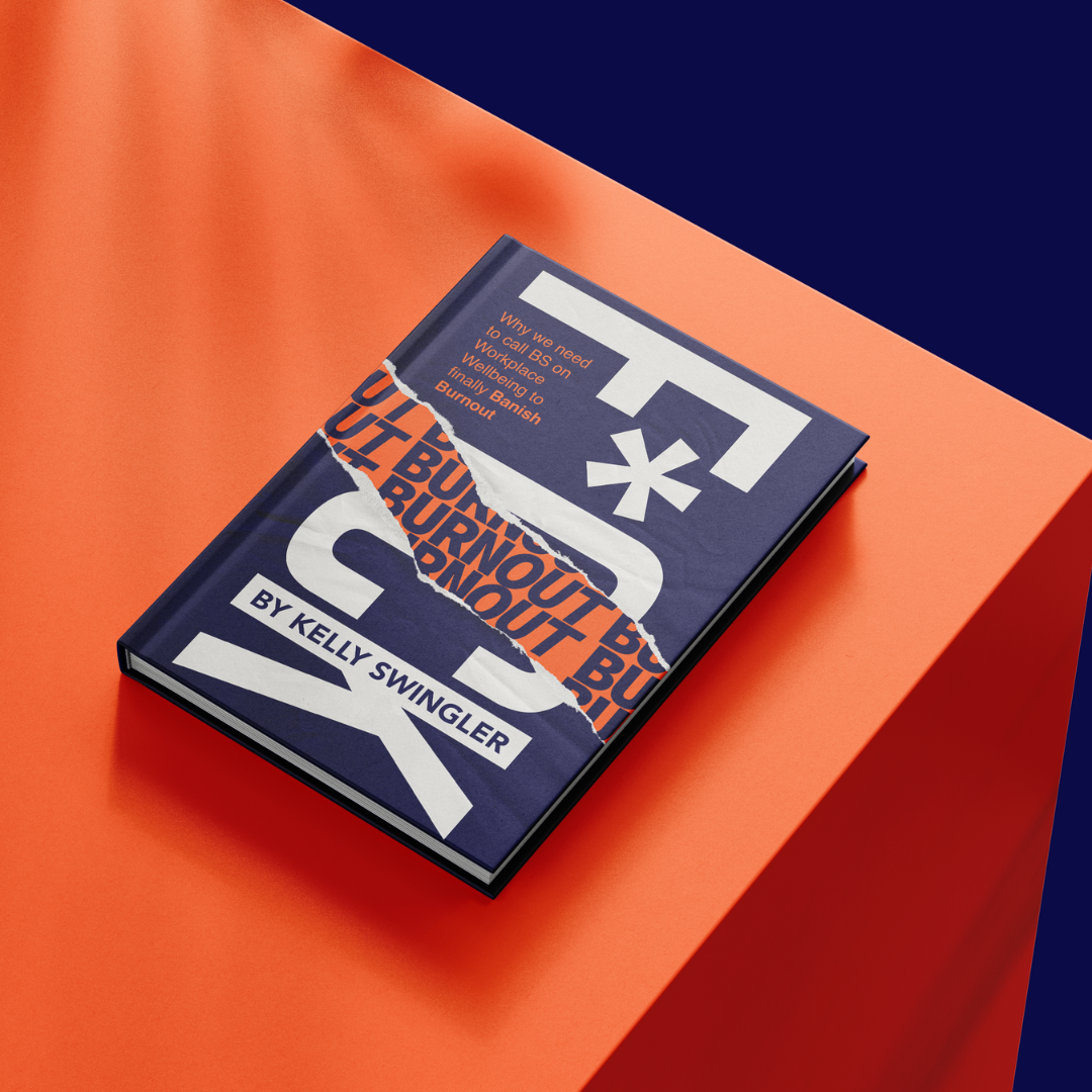 A book titled 'Tired' by Kelly Swangler with a torn cover revealing the repeated word 'Burnout' in orange on a dark background, placed on an orange and navy blue surface.
