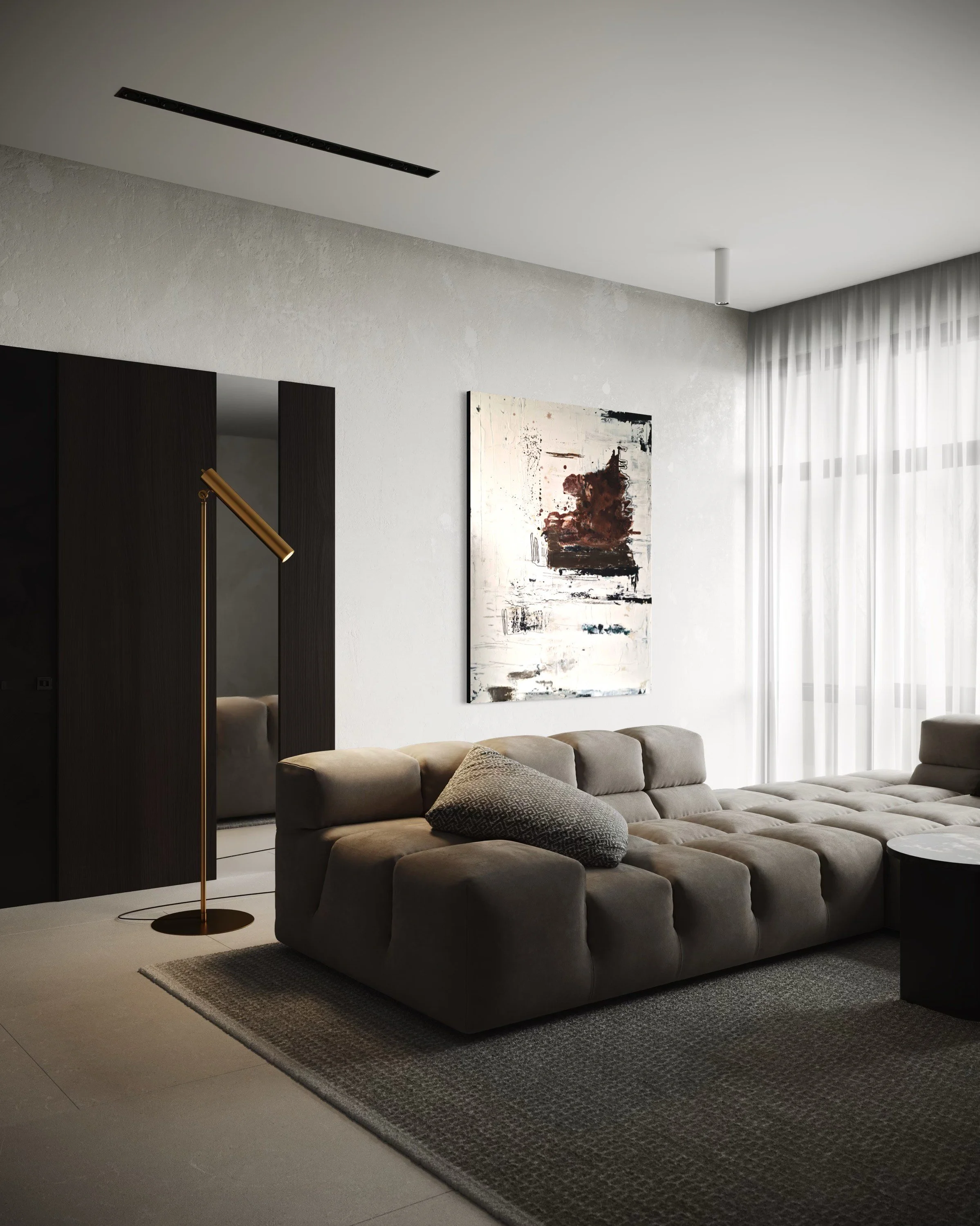 Modern living room with beige sectional sofa, abstract wall art, dark wood panel, tall gold floor lamp, sheer white curtains, and textured area rug.