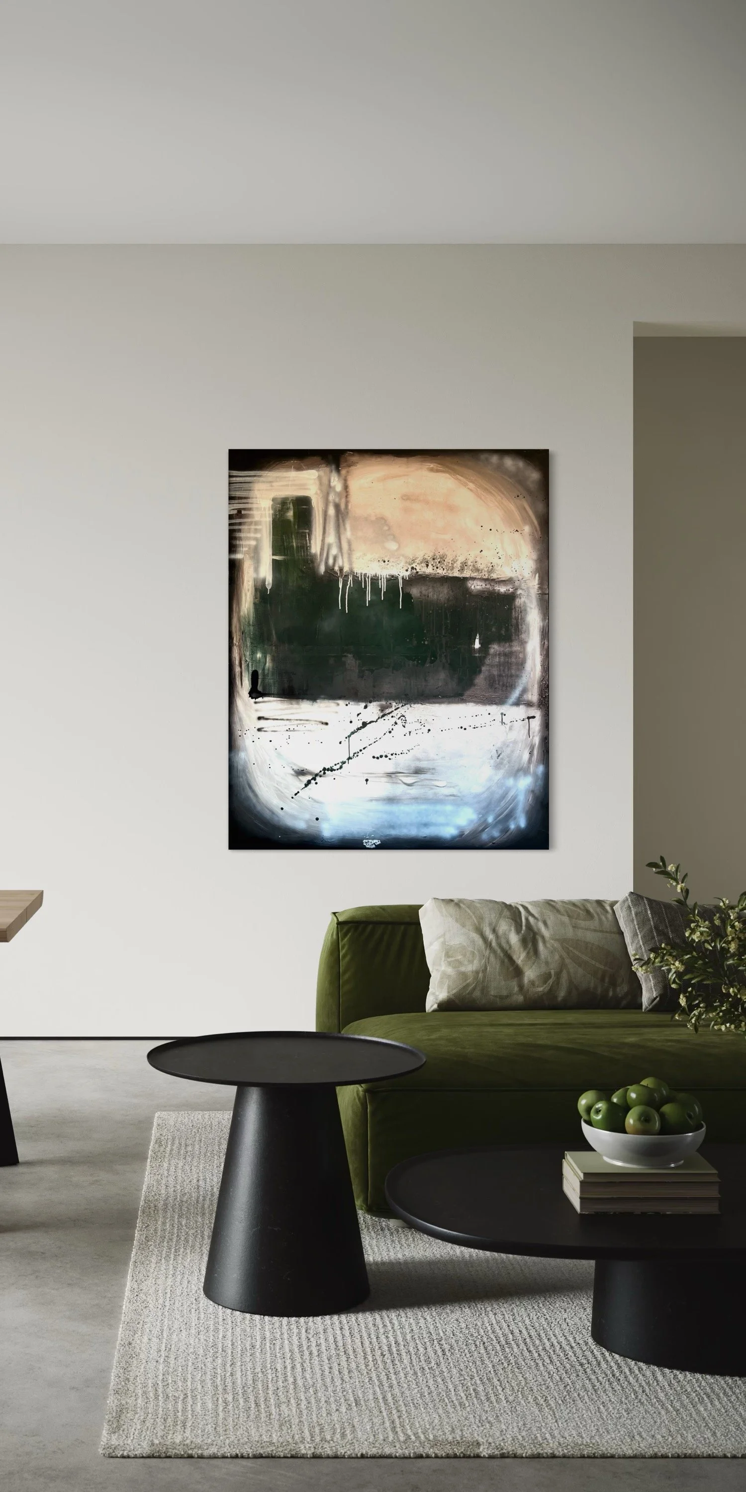 Modern living room with a green sofa, abstract wall art, black coffee tables, a white bowl of green apples, and a neutral-toned rug.