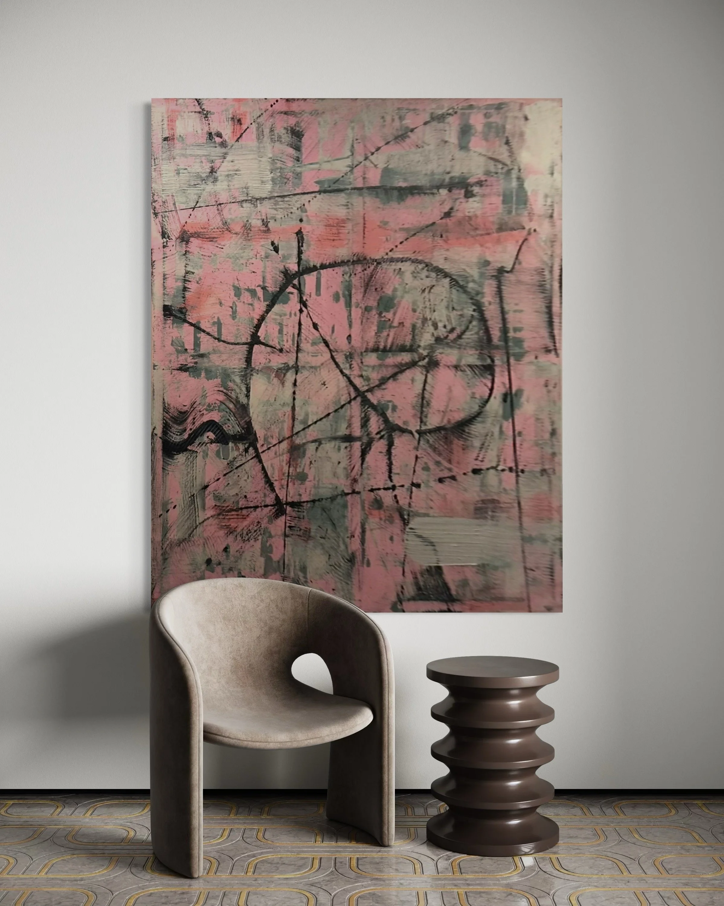 Modern living room corner with an abstract pink and gray painting on the wall, a beige curved armchair, and a dark brown sculptural side table, wood patterned flooring.