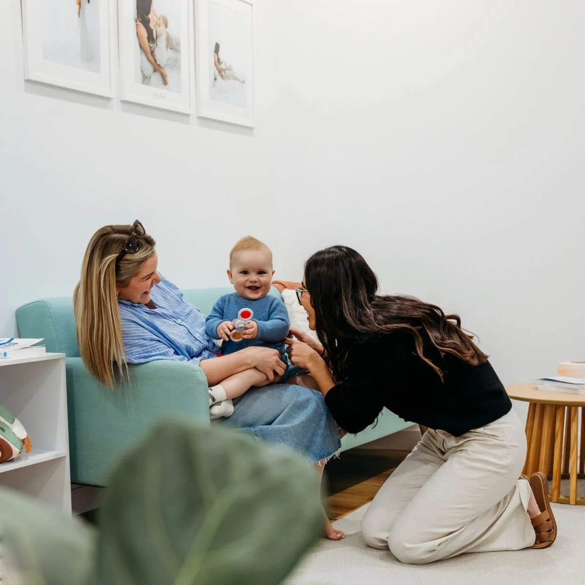 Lactation consultant and midwife supporting mother and baby during feeding and oral function assessment at The Gentle Village Perth