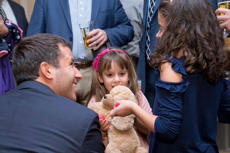 A child receiving a gift at a foundation event