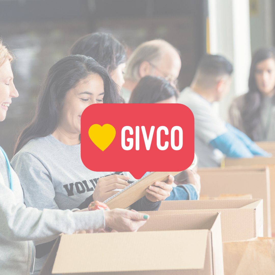 Group of volunteers packing boxes with a logo overlay "GIVCO"