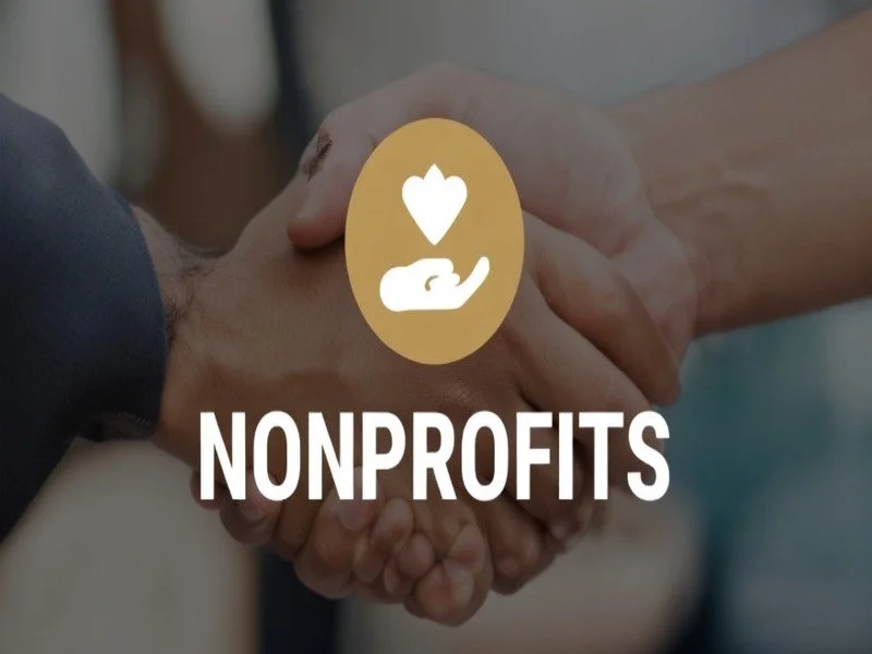 Two hands holding a heart icon representing fund accounting and grant tracking services for 501c3 nonprofit organizations.