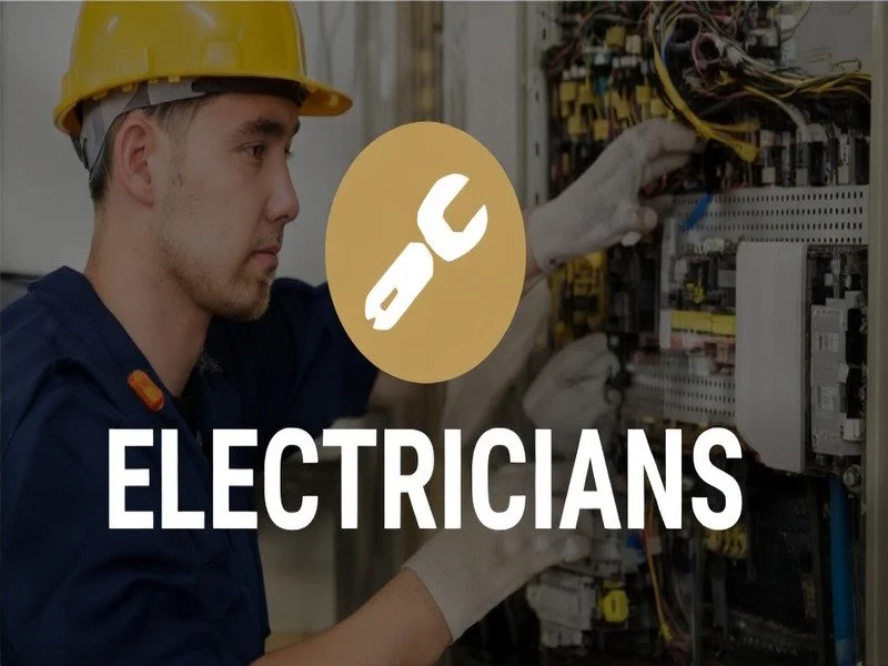 An electrician working on a circuit breaker representing financial reporting and tax planning for electrical contractors.