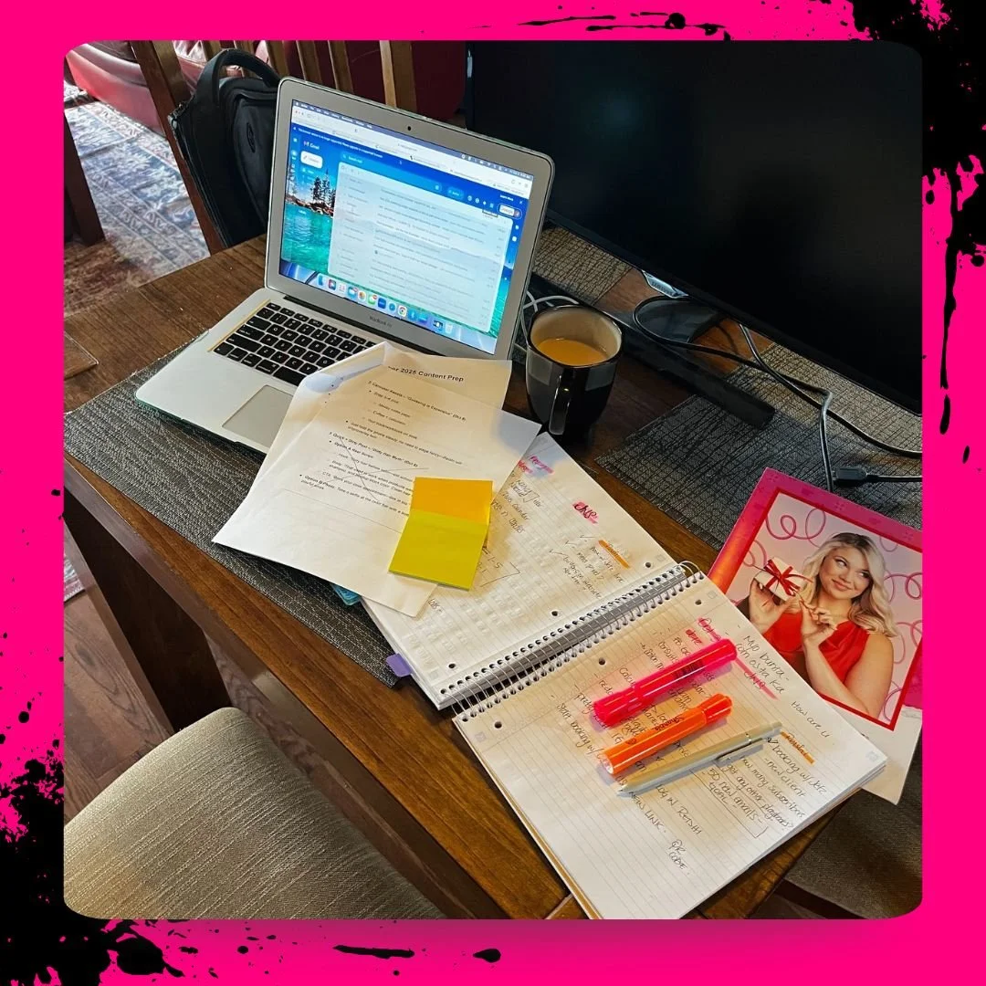 Business planning workspace with a laptop, open notebooks, handwritten notes and colourful highlighters.