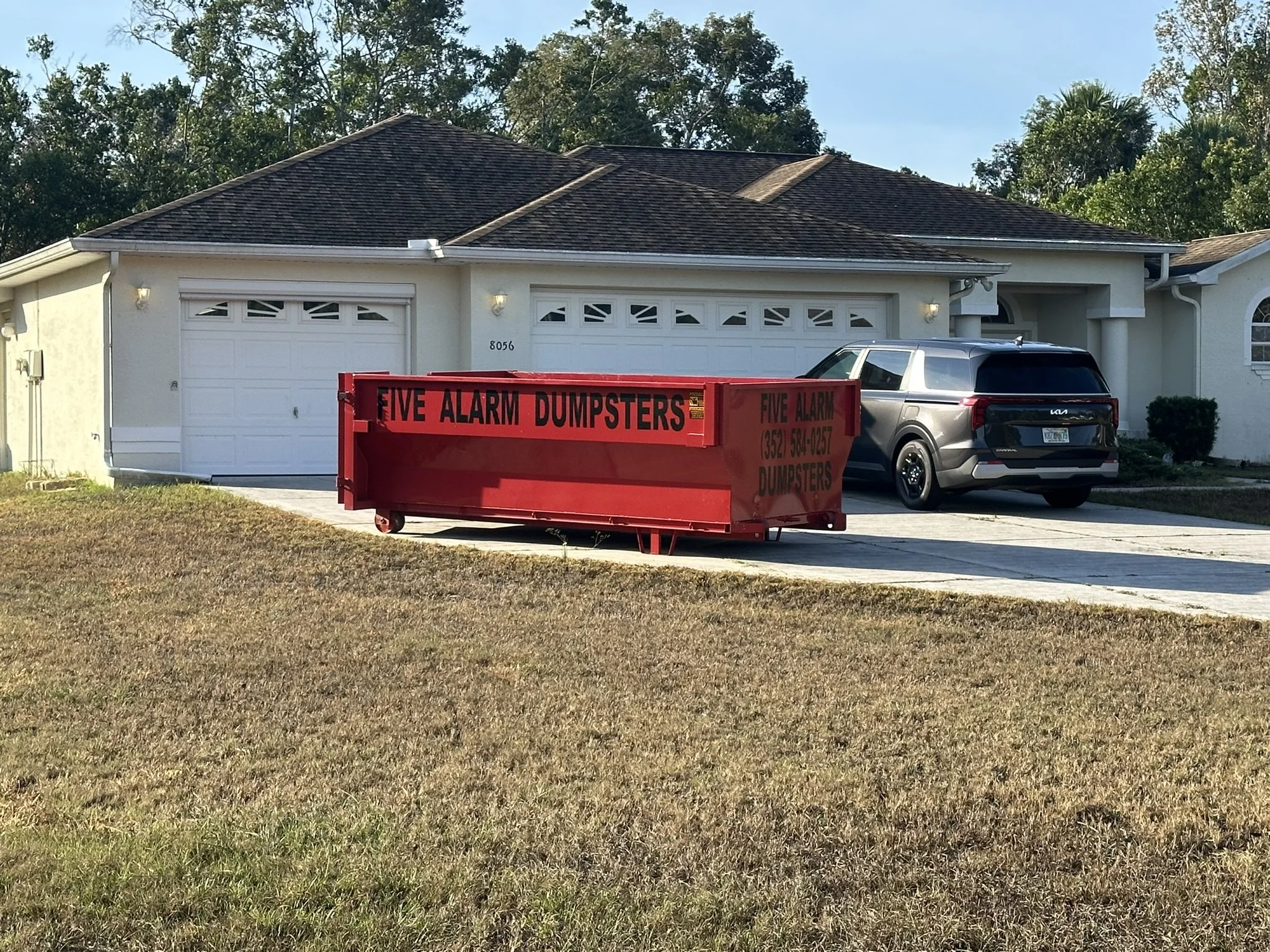 Roll-off dumpster rental delivered to a home in Timber Pines, Spring Hill, Florida.