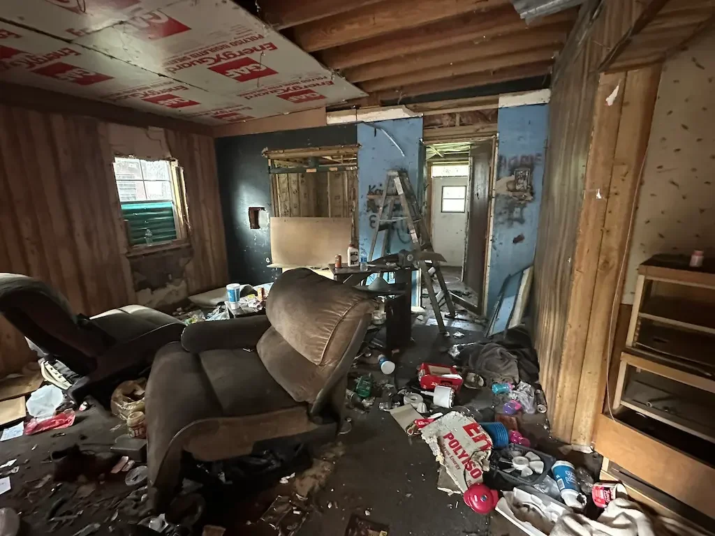 foreDebris and furniture piled up for aclosure cleanout in Spring Hill, FL by Five Alarm Dumpsters