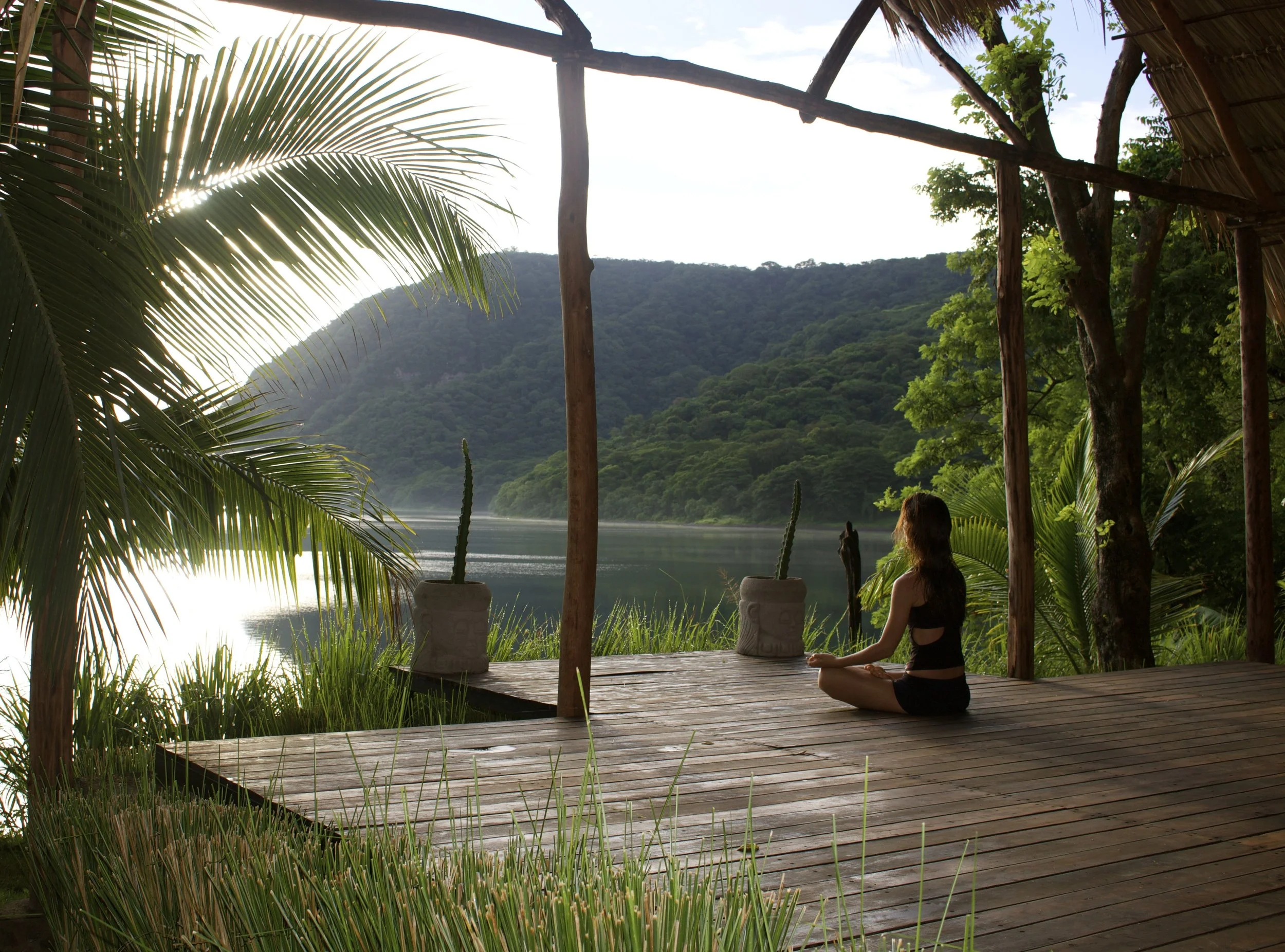Sasha Noelle meditating lakefront in Laguna de Apoyo, Nicaragua.
