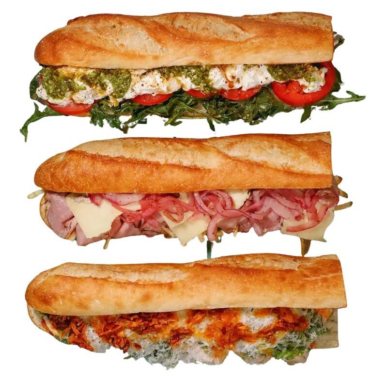 Cut out photo of the Caprese sandwich, the Beef sandwich, and the viral chicken sandwich. This image has no background.