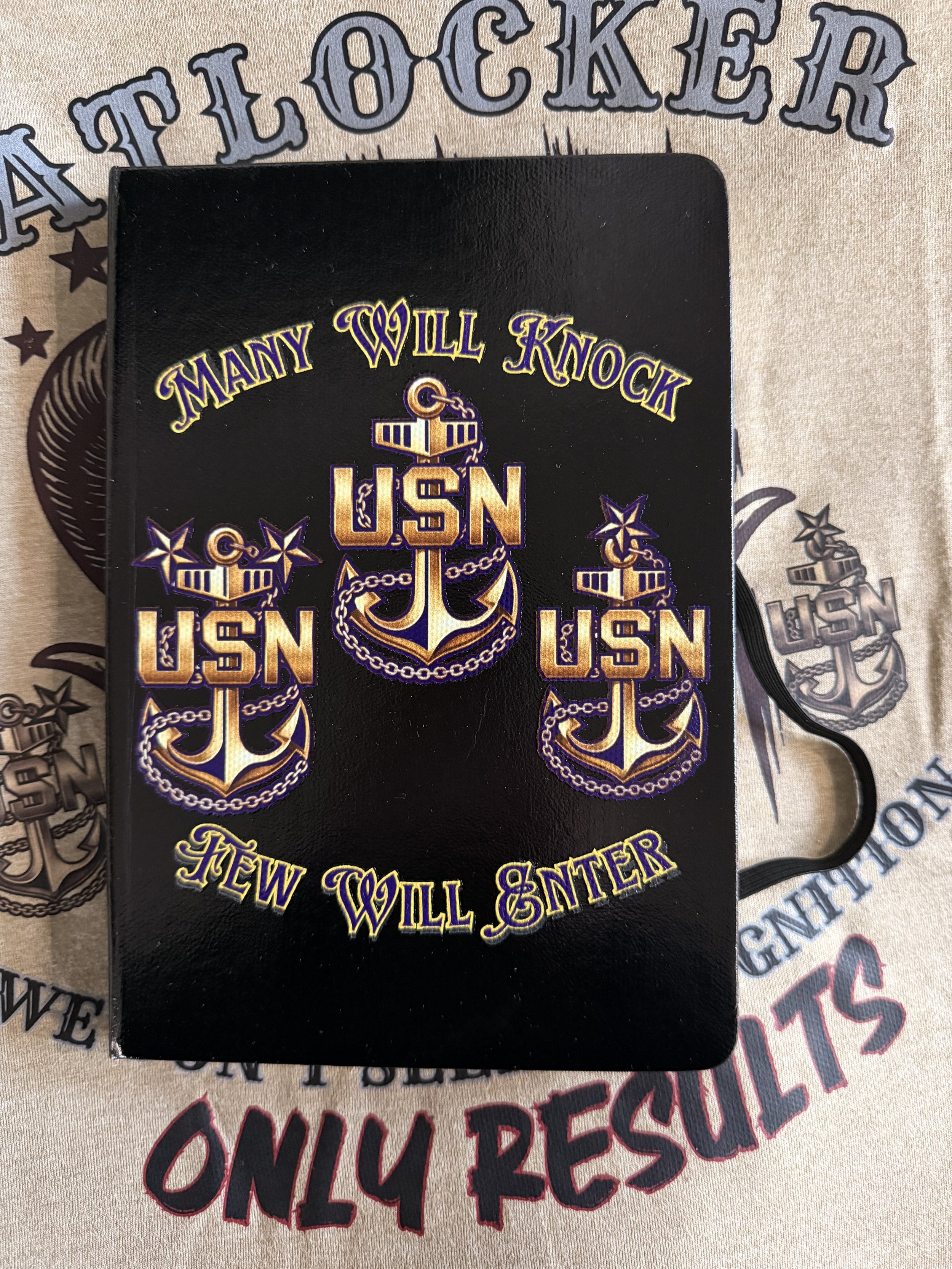A black patch with gold and purple embroidery featuring the phrase 'Many Will Knock USA,' an anchor, and chains, placed on a fabric with a larger printed design of the same patch and the words 'Only Respect.'