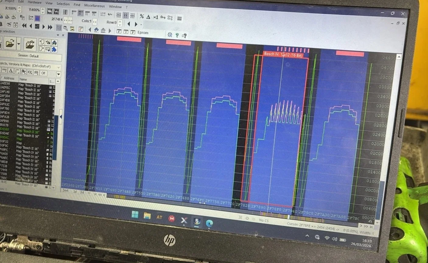A computer screen displaying winols hex editor software with graphs and data charts.