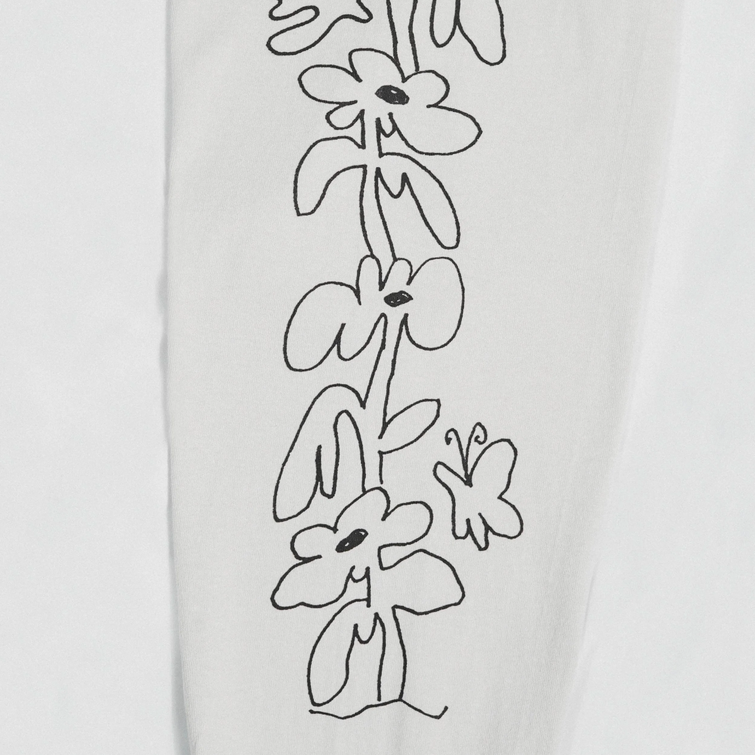 Black line drawing of flowers and butterflies on white background.