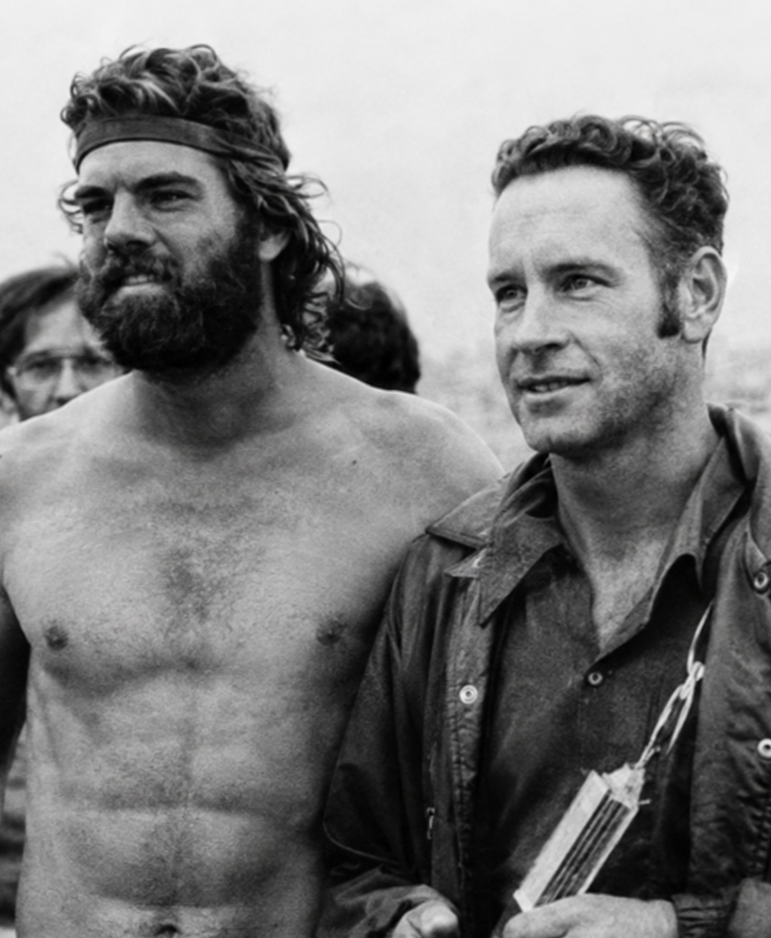 Tom Warren (left) and Bill Phillips, shown here after they teamed up to win the 1976 Triathlon Relay. Bill, a leading masters runner, was on the Mission Bay Triathlon committee and the Dave Pain Biathlon twice. Tom, who sponsors the Jog & Javen Swim-