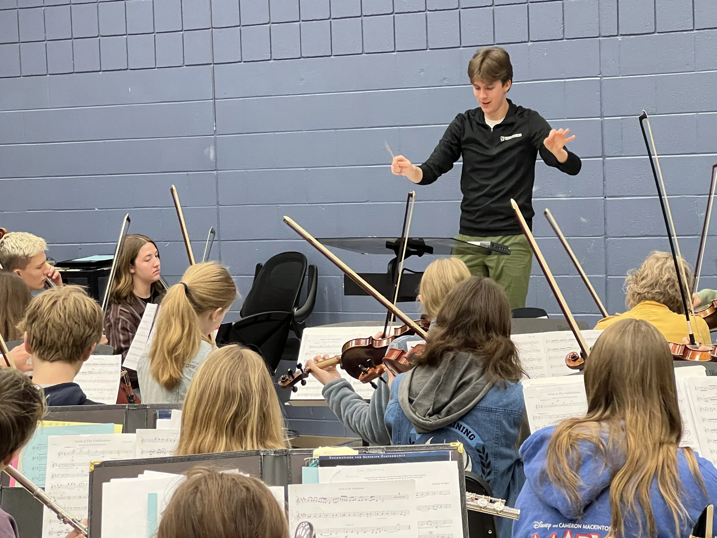 Conducting and rehearsing my arrangement of Great is Thy Faithfulness with the GRCHS Orchestra and Band, Fall 2023