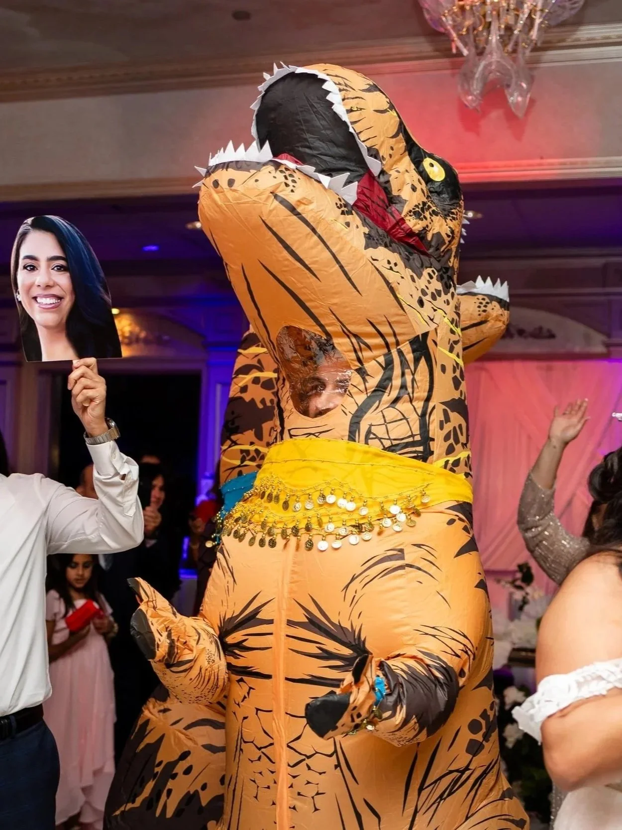 An inflatable dinosaur is dancing at the wedding reception at Il Tulipano in New Jersey. 