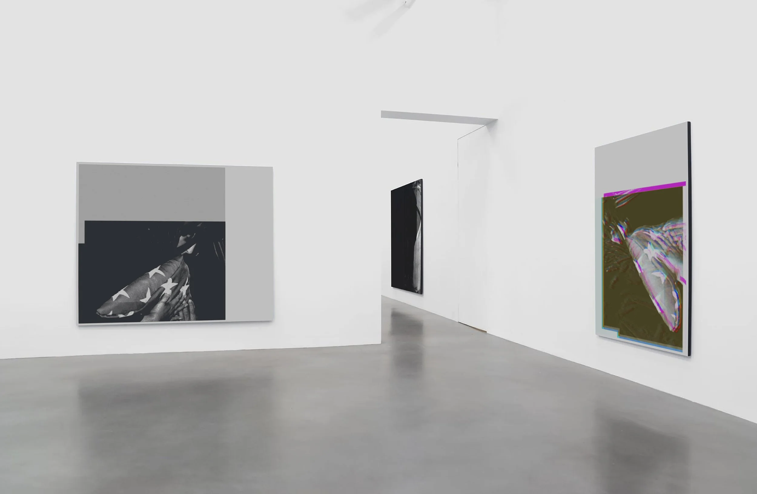 Modern art gallery with three abstract paintings on white walls and gray floors.