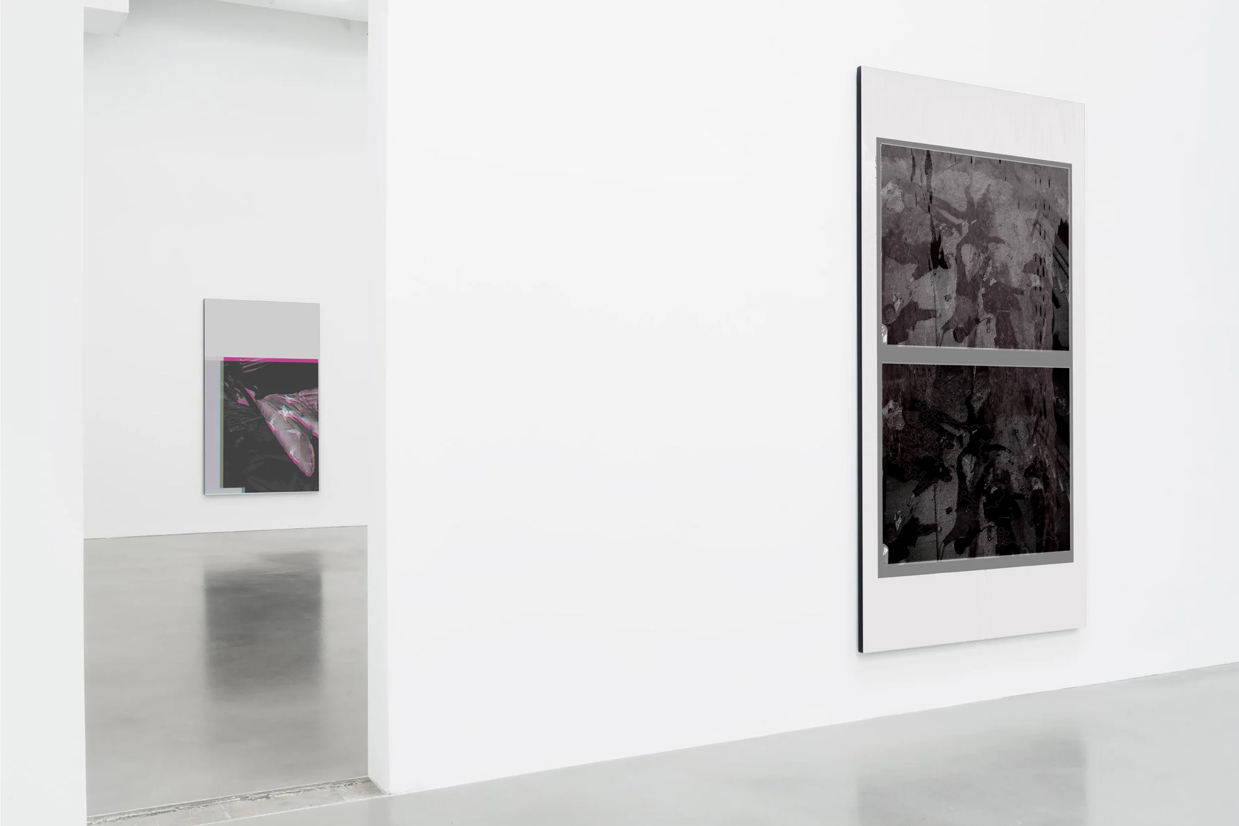 Gallery with two abstract contemporary art pieces on white walls, one with dark colors and the other with black and gray tones. The gallery has a clean, minimalistic design.