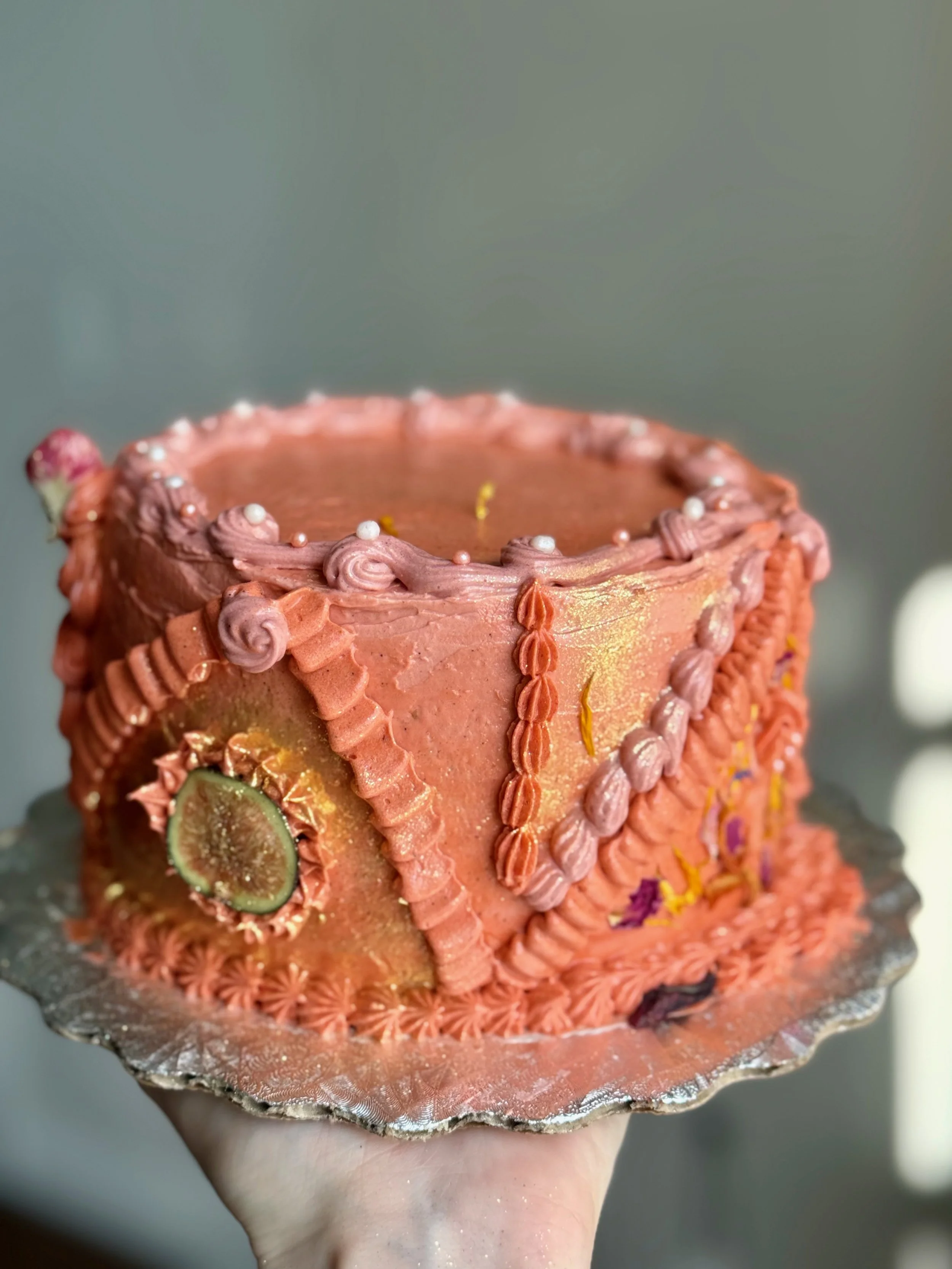 cardamom sponge + sage cake soak + pomegranate hibiscus curd + rose-tonka bean swiss meringue buttercream