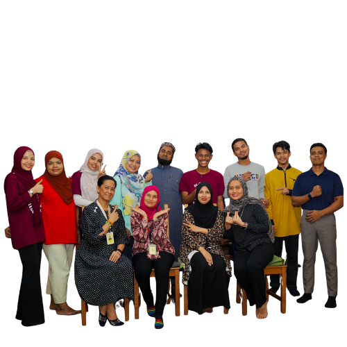 Group of diverse professionals posing together in a casual setting, some standing and some seated, smiling at the camera.