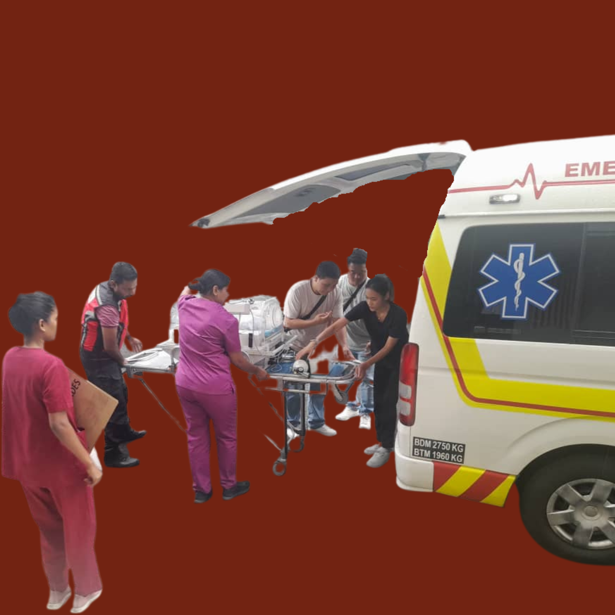 Medical team transferring a patient on a stretcher into an ambulance.