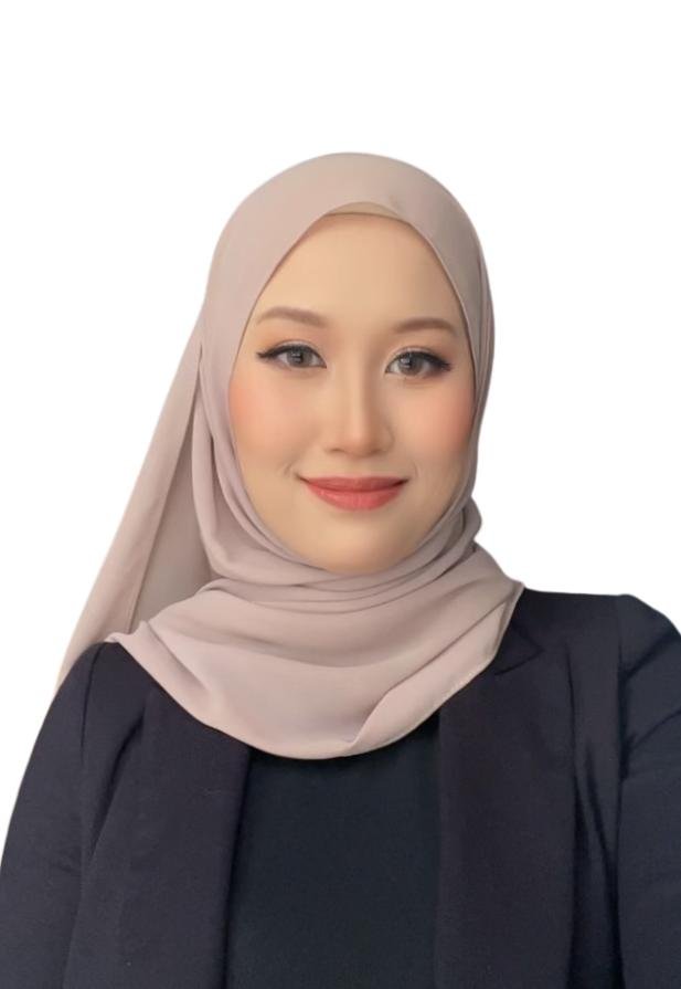 A woman wearing a beige hijab and a black blazer smiling at the camera with a white background.