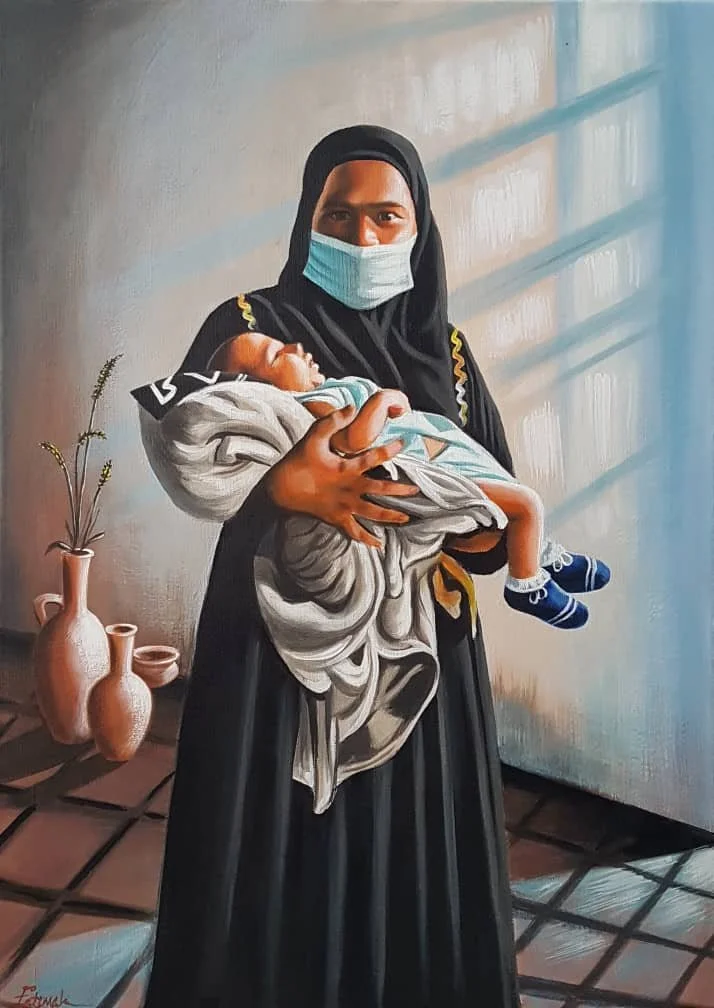 A woman wearing a black dress and a protective face mask holds a small child wrapped in a blanket. They are indoors with a tiled floor and three pink vases with plants in the background. Sunlight creates shadows on the wall.