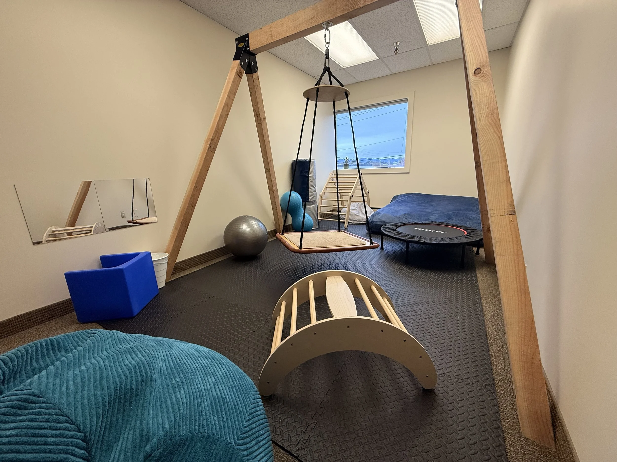 Jump, swing, shake, and wiggle in our movement room!