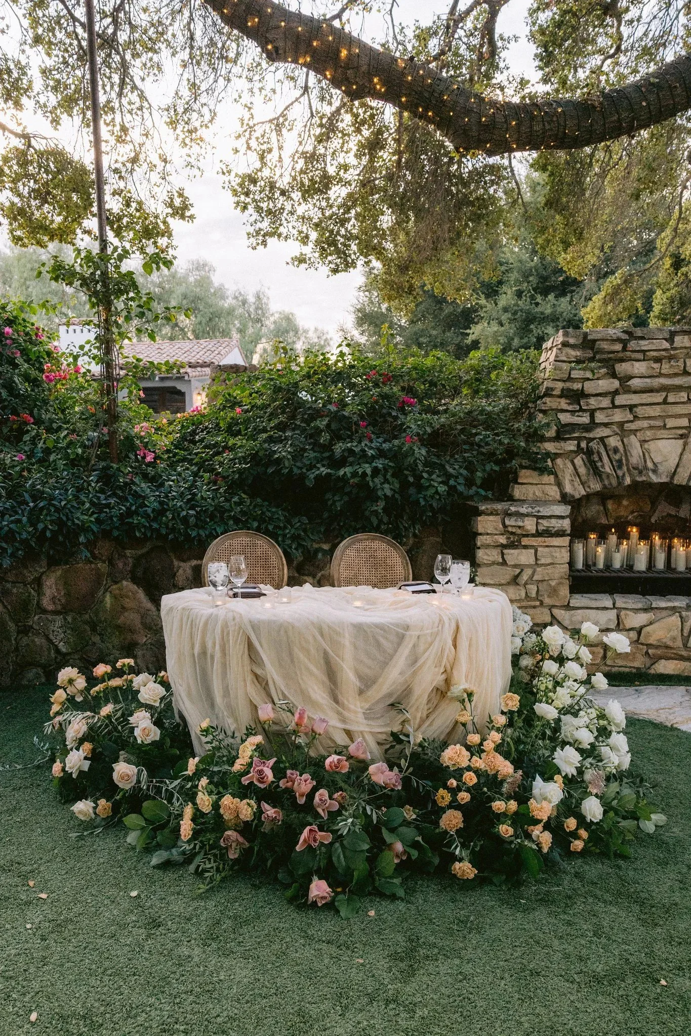 sweetheart table surrounded by floral