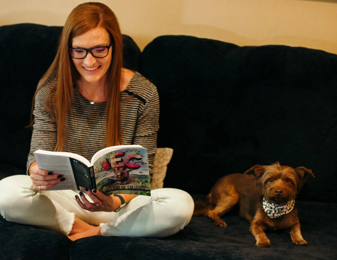Lindsey and Zephyr sit on the couch and plan their next university visit