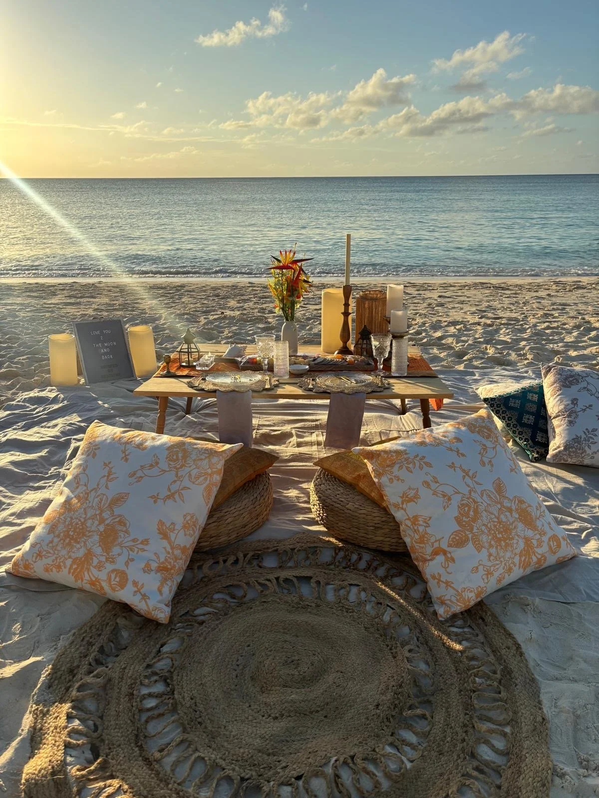 Luxury beach picnic setup on Seven Mile Beach in Grand Cayman by Soirées by Starling