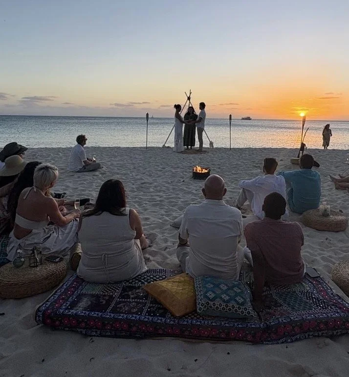 An intimate beach ceremony at sunset in Grand Cayman