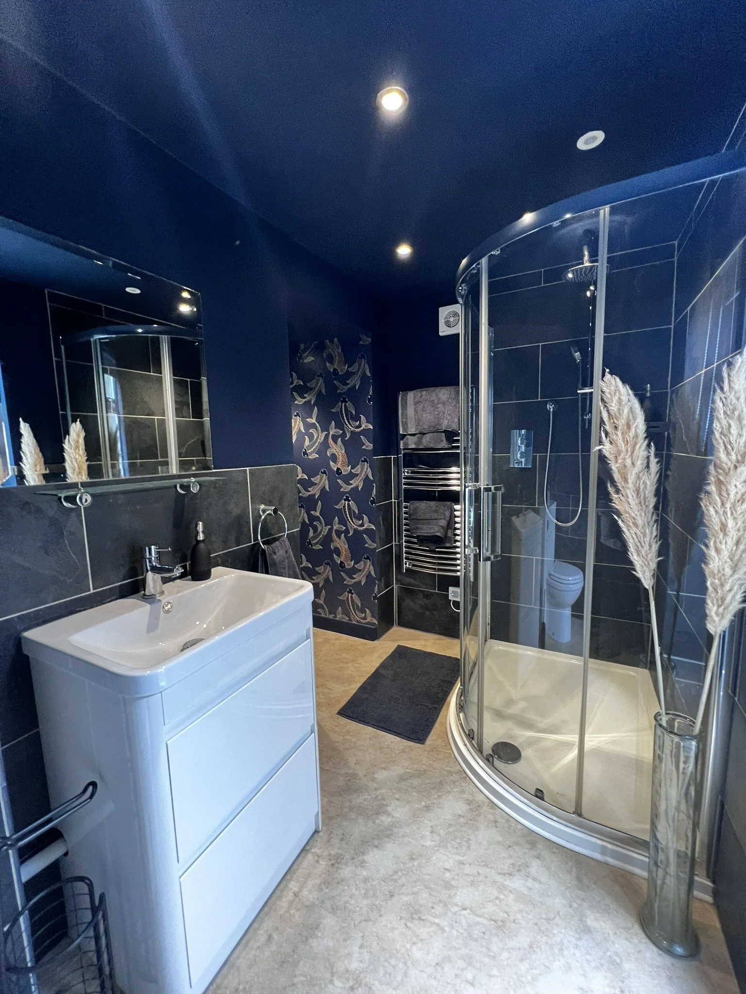 Modern bathrooms with walk-in showers, deep baths, and quality amenities