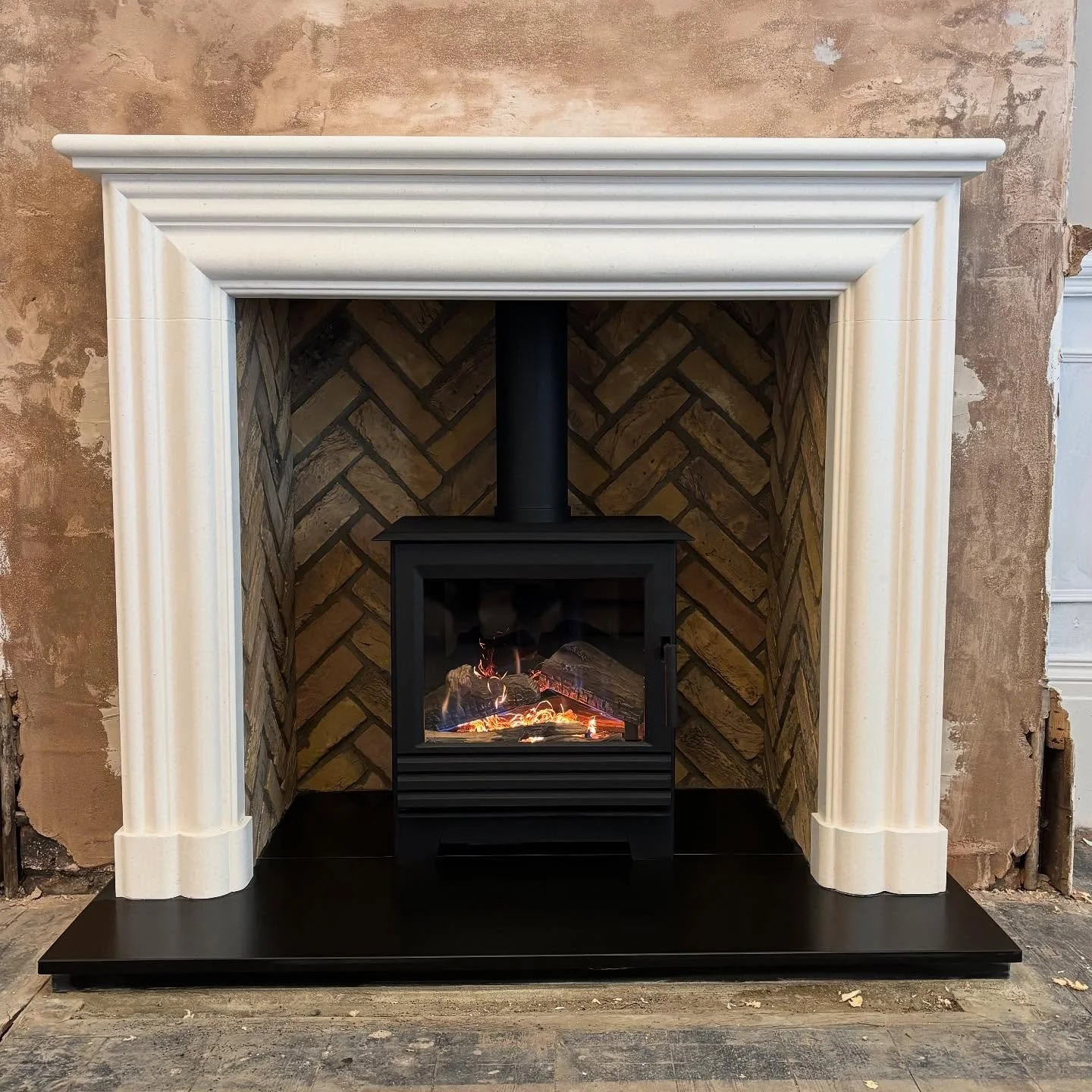 Here&rsquo;s a little project we&rsquo;ve just finished for a friend. 

A very classy streamlined limestone surround with a slick hardwearing honed granite hearth. 

Finished off with a white herringbone brick slip interior to give the lovely contras