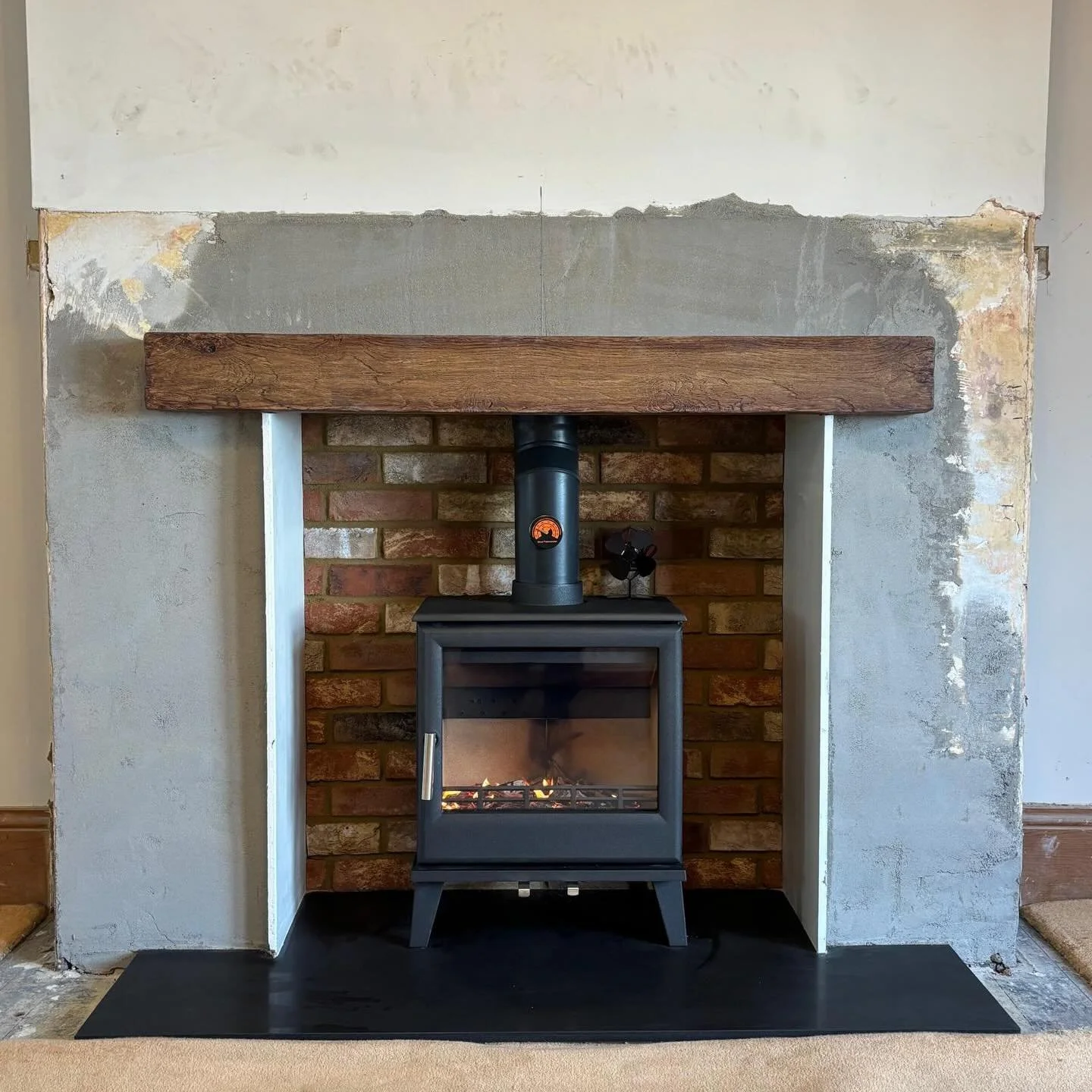 🔥 Just completed this stunning fireplace transformation!

We paired a sleek honed granite hearth with elegant fireboard sides and a beautiful brickslip back, finished off with a modern non-combustible beam. At the heart of it all is the fantastic Ca