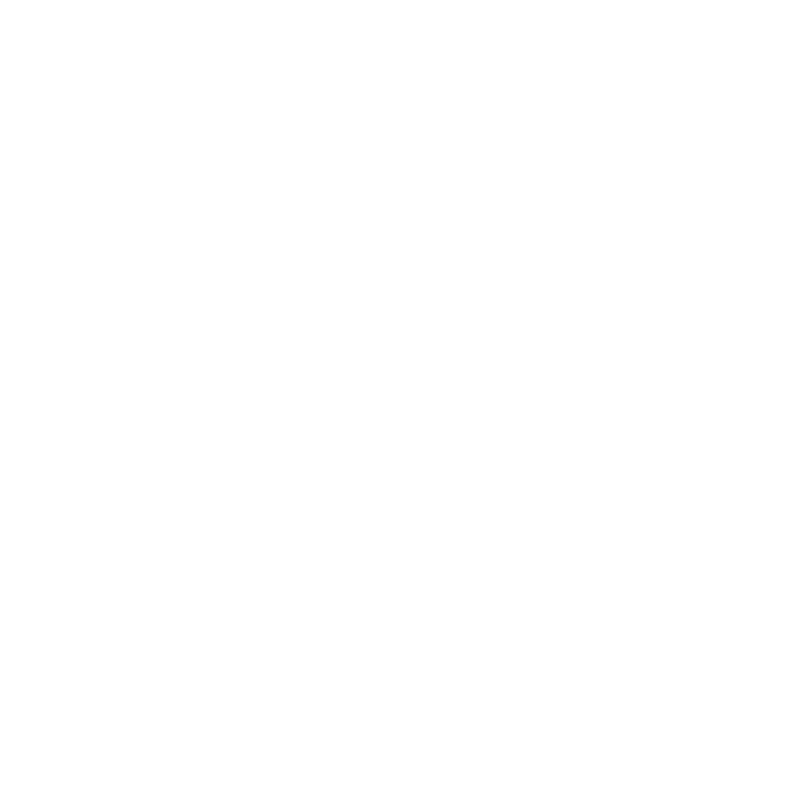 A person holding a white smartphone in their hand, with a public artwork in the background.