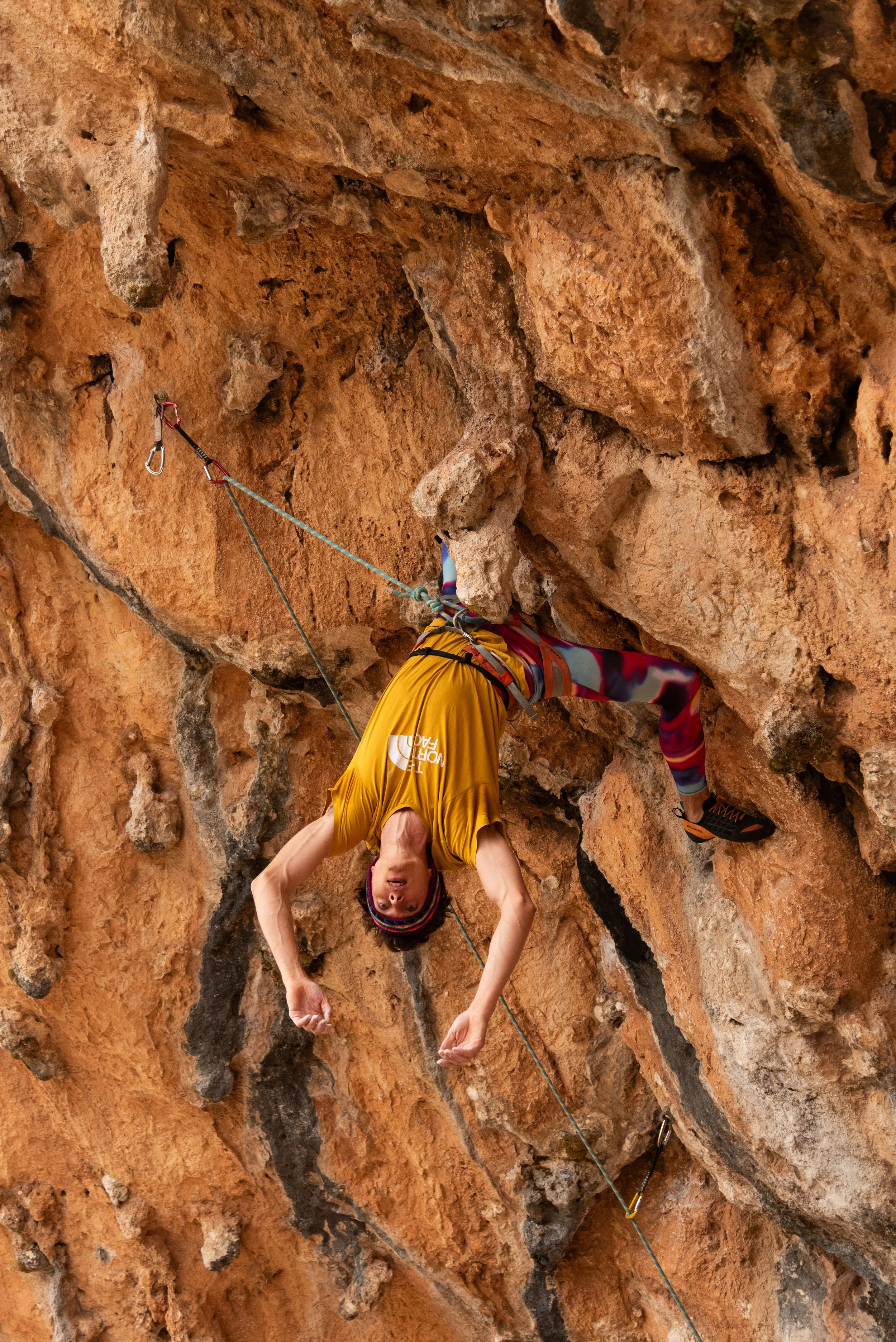 A person climbing very hard sport-routes in Morocco, Akchour. Using advanced climbing techniques.
