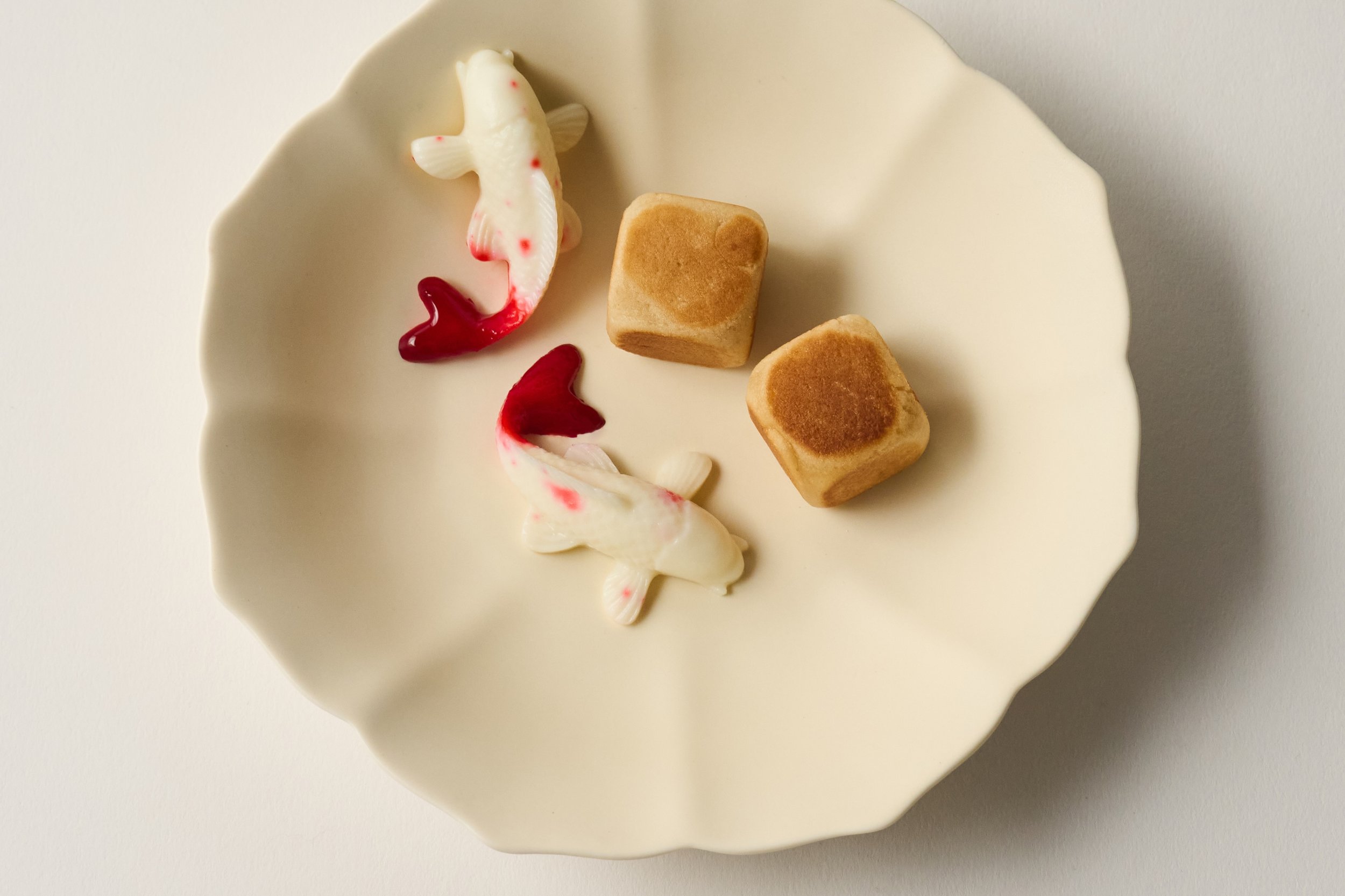 Our four-course tasting is just the beginning. The kitchen always finds ways to send a little more — small, unexpected treats that add a sense of play. These koi gummies are one such surprise: delicate, house-made confections that nod to the tranquil