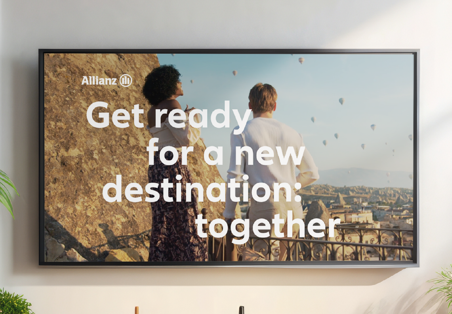 allianz commercial on tv screen that reads "get ready for a new destination: together"
