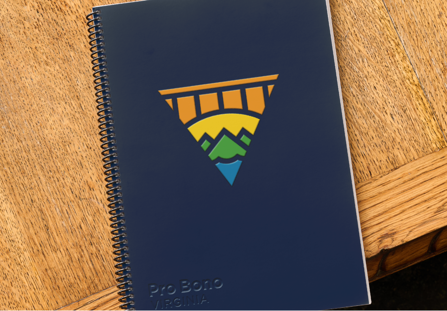 spiral notebook with pro bono virginia logo on the cover