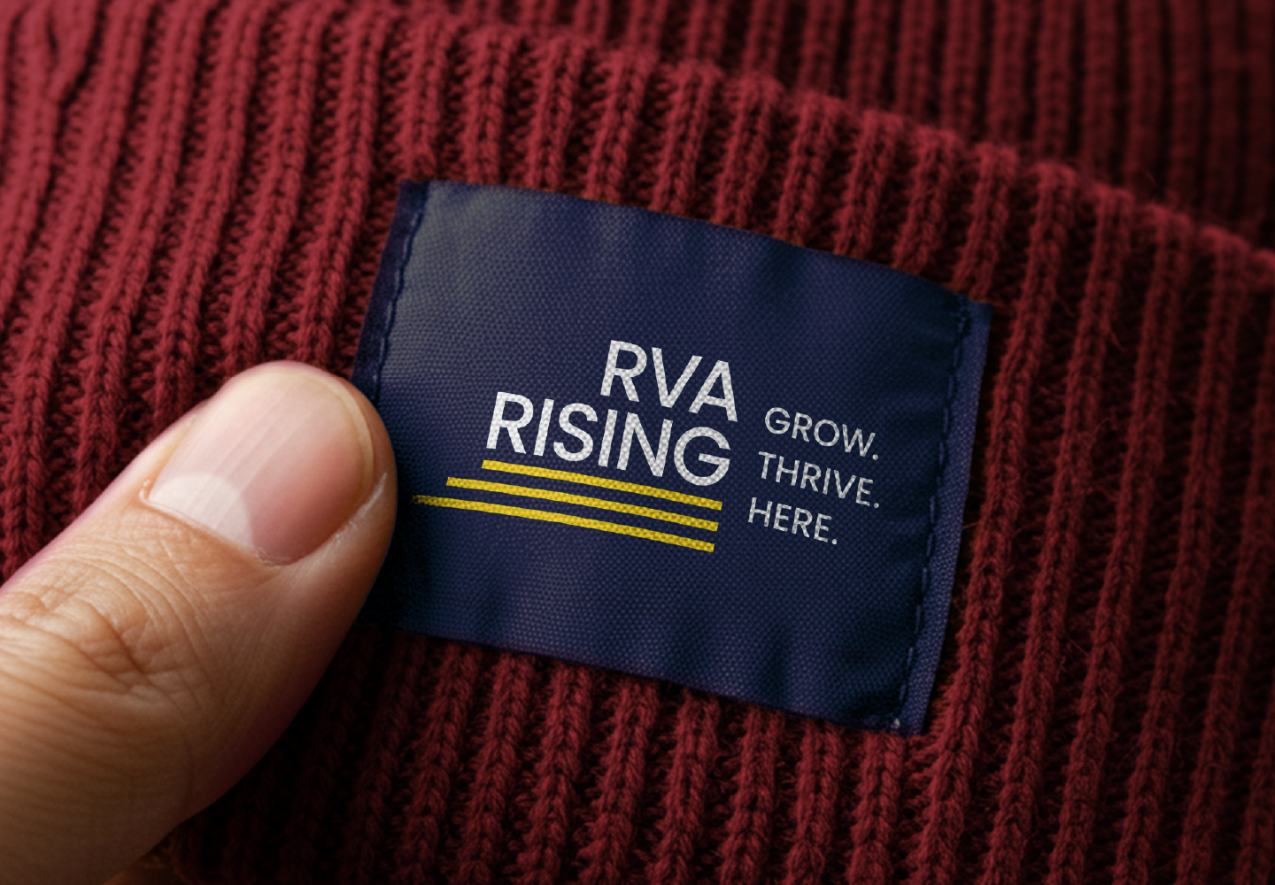 rva rising logo and tagline on a knitted hat