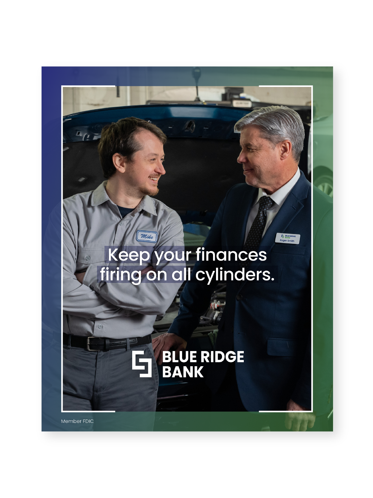 A mechanic and a man in a suit talking in an auto repair shop. The mechanic is wearing a gray uniform with 'Mike' on the name tag, and the man in the suit has a name tag that says 'Roger Smith.' There is a car with its hood open in the background.