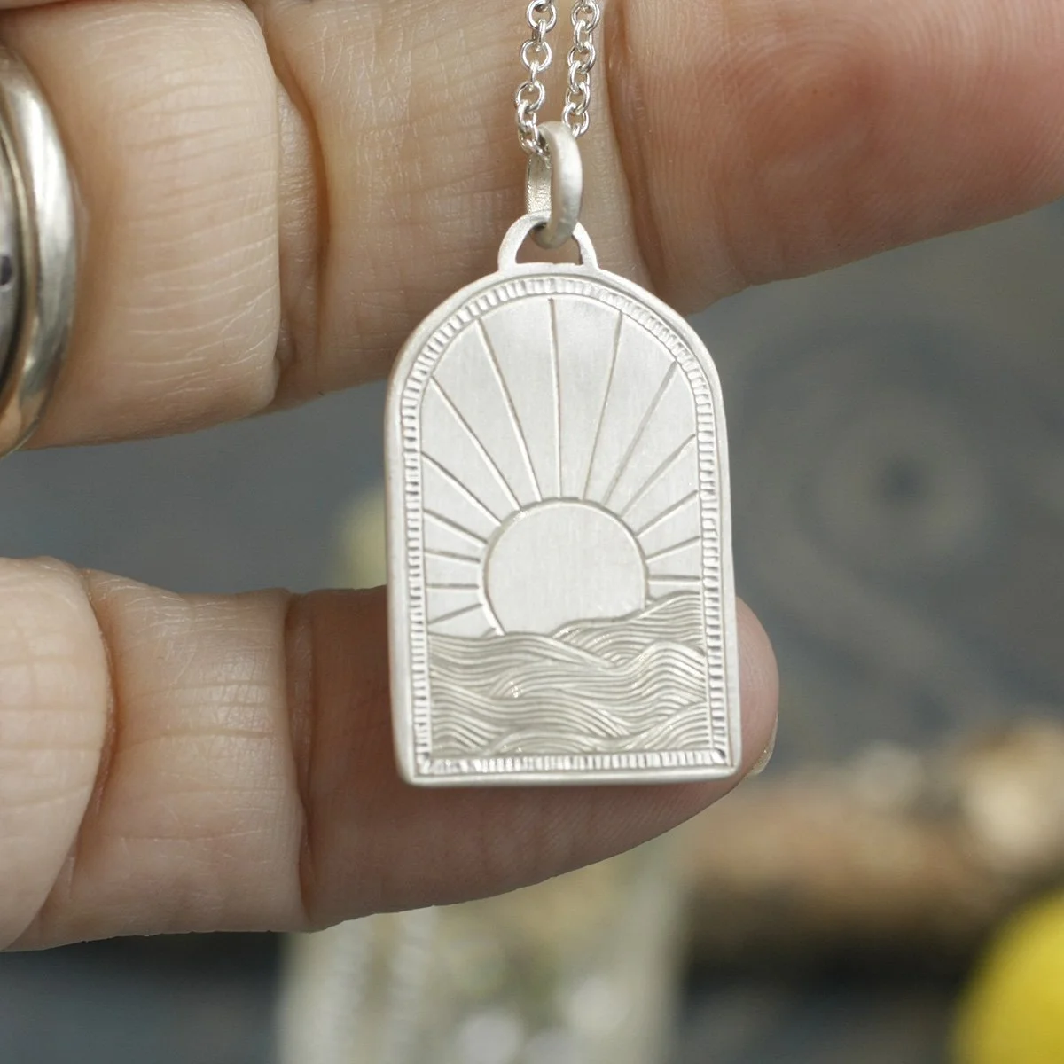 Gravée Portal Arch Sunrise Over Waves Pendant 2.jpg