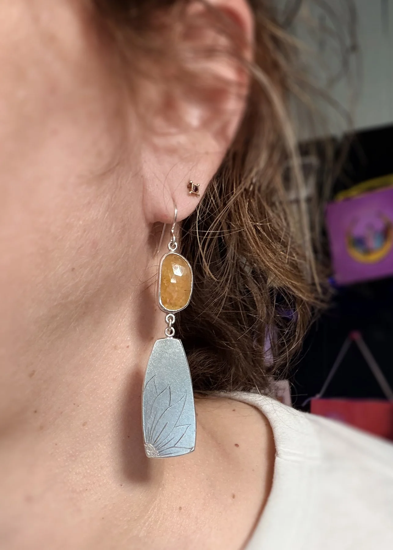Sunflower earrings on.jpg