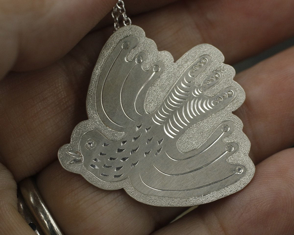 Gravée Swooping Bird Folk Art Style with Dotted Wings Pendant.jpg