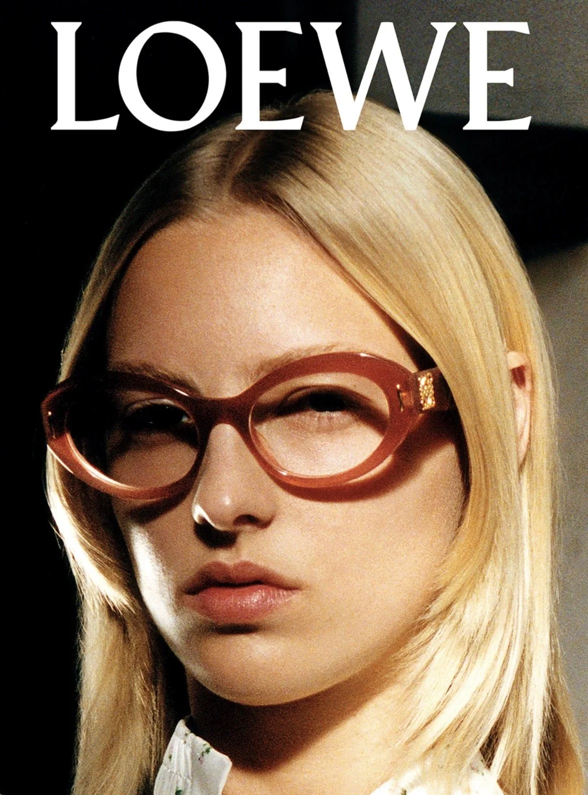 young woman wearing an oval loewe frame