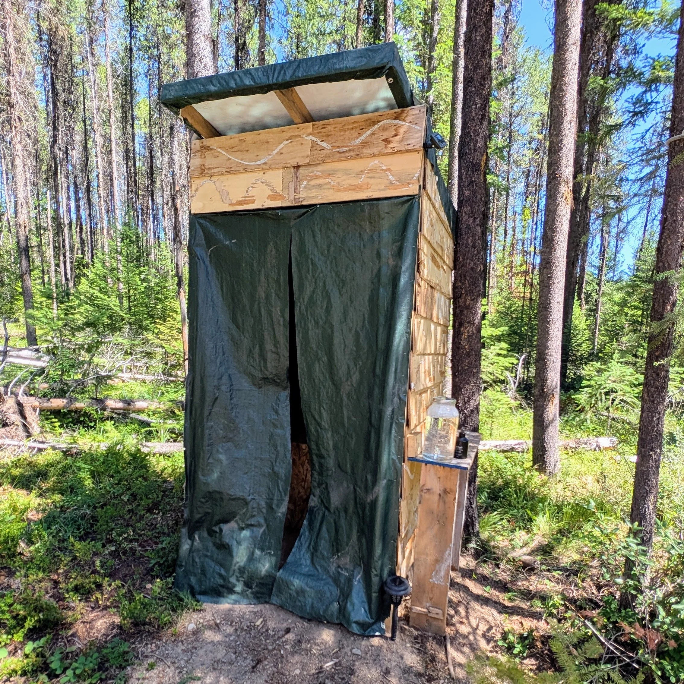 Ah a beautiful outhouse! What could be better than pooping in the fresh air? Outhouses and gravity fed potable water dispensers are currently the only washroom/cleaning facilities available at Storia Vale.